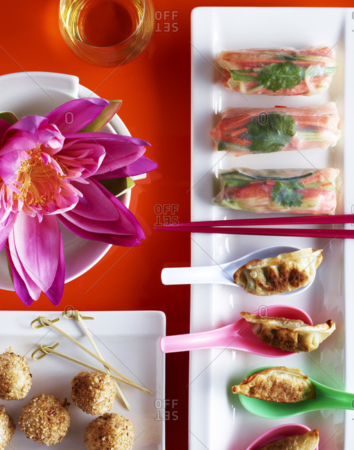 Colorful japanese appetizers with exotic flower.