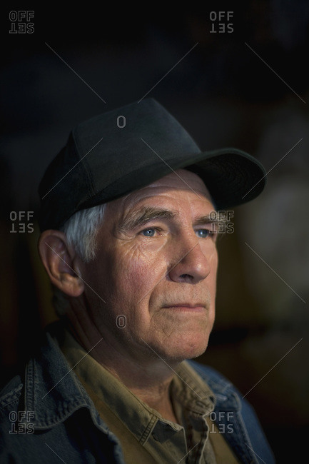 Portrait of a senior man wearing a trucker\'s hat