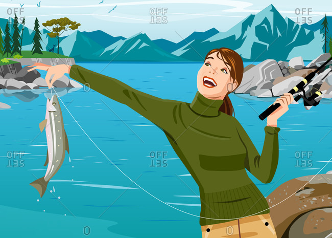 Woman in sweater holding fishing pole and fish in front of lake and mountains
