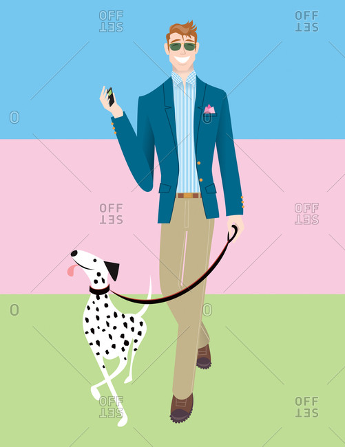 Stylish guy in navy blazer and khaki trousers walking a dalmatian on a leash