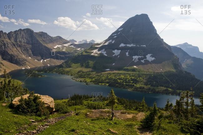 Bearhat Mountain is surrounded by Hidden Lake in Glacier National Park, Montana