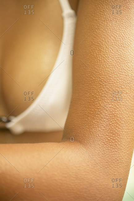 Close up of woman\'s arm with goose bumps