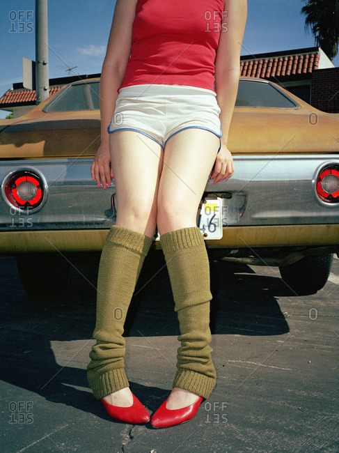 Young woman in leg warmers and heels