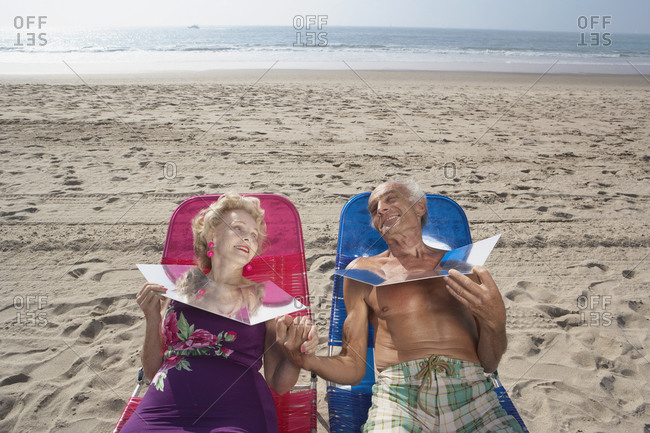 Senior couple sunning themselves at the beach