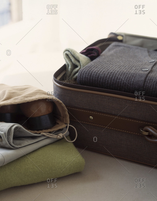 Close up of an opened suitcase with clothing