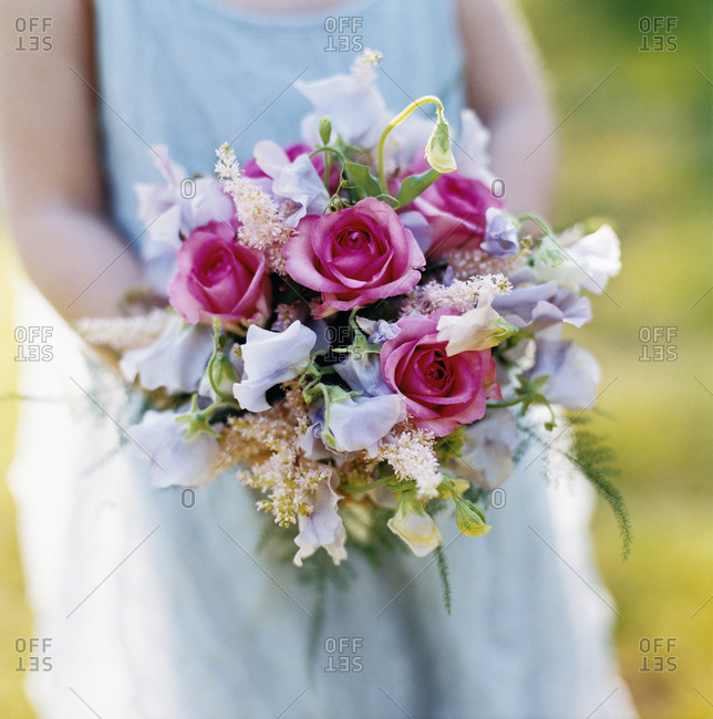 A bouquet with roses and sweet peas, close-up