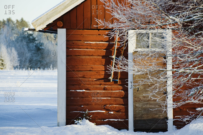 Wooden cabin in snow building
