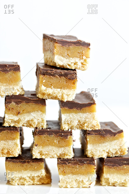 Caramel bars with melted chocolate in stack
