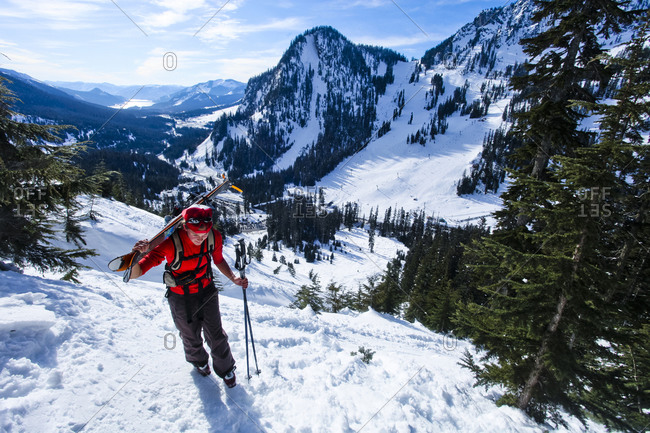 A female snow hiker boot packs up an icy section on Snoqualmie Peak.