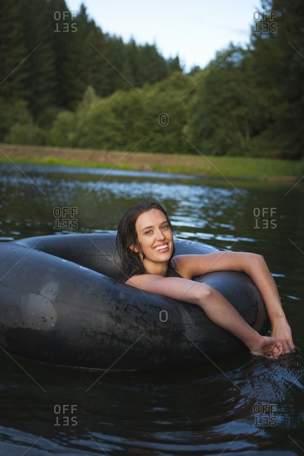 Woman Floating in an Inner Tube, Near Portland, Oregon, USA
