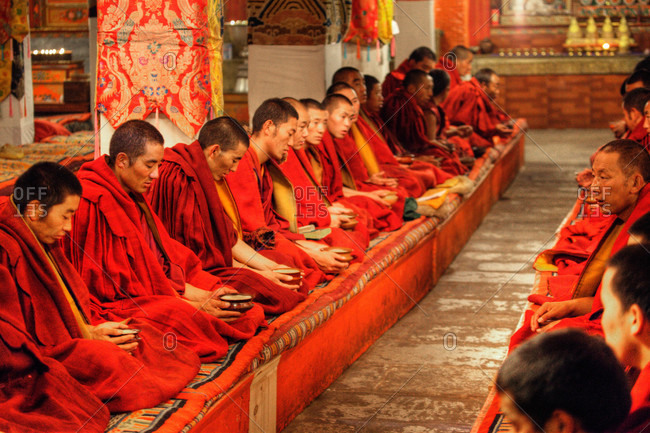 Monks in prayer, Ganden Monastery, Tibet