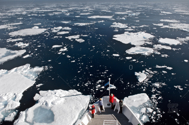 Spitsbergen, Svalbard, Norway-Tourists on cruise ship looking icebergs