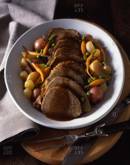 Pork loin served with stewed vegetables and tasty gravy