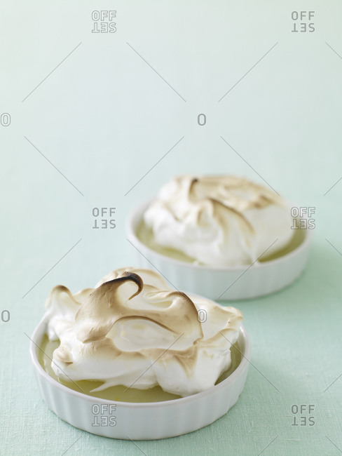 Two portions of lemon custard with meringue topping