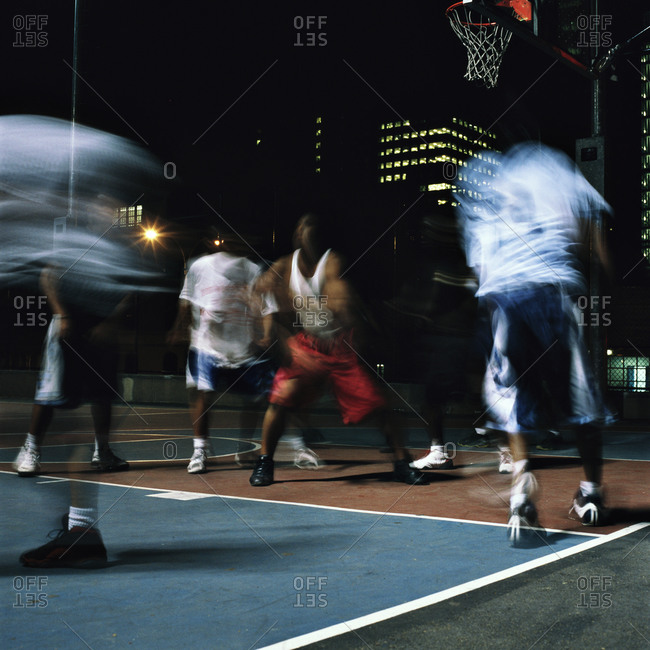 Men Playing Basketball At Night