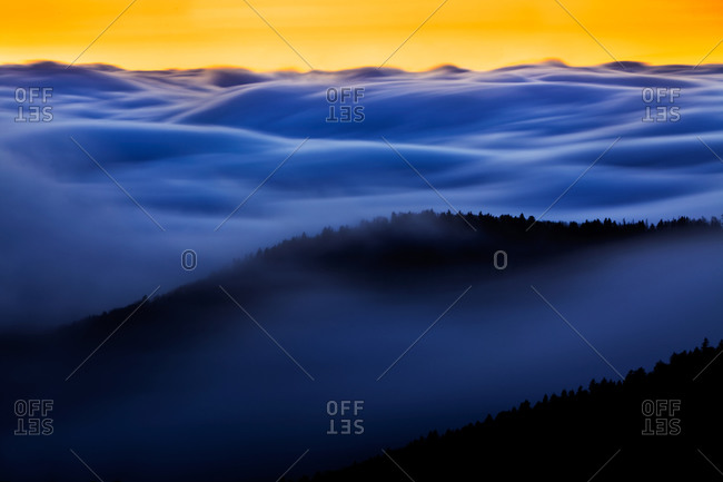 Ocean of clouds moving through mountain ridges at twilight in Clingmans Dome, Great Smoky Mountains National Park, Tennessee and North Carolina