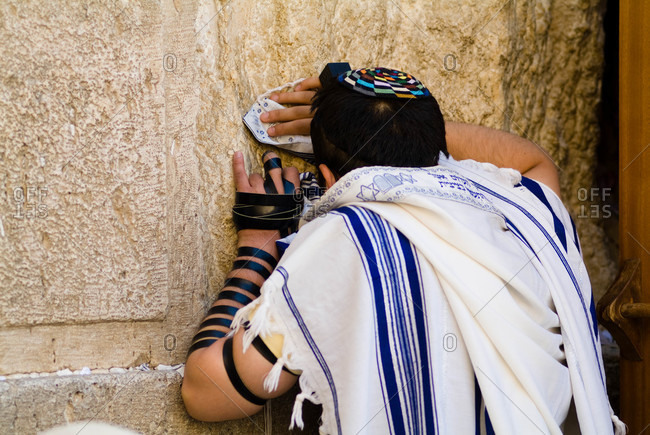The Western Wall, Jewish man wearing a prayer shawl \
