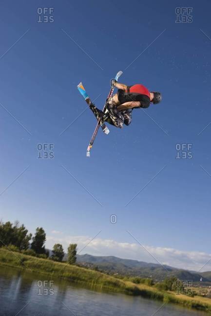 Ski jumper in twisting in the air