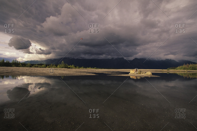 Red Floatplane And Thunderstorm Over The Knik River Near Palmer, Alaska