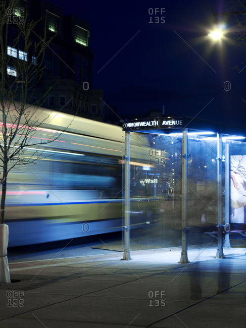 Motion Blur Of Bus Passing By Bus Stop