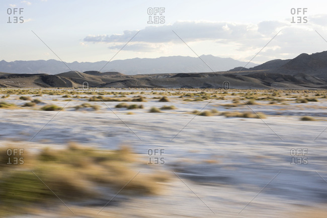 Desert Landscape Through Window Of Moving  Car