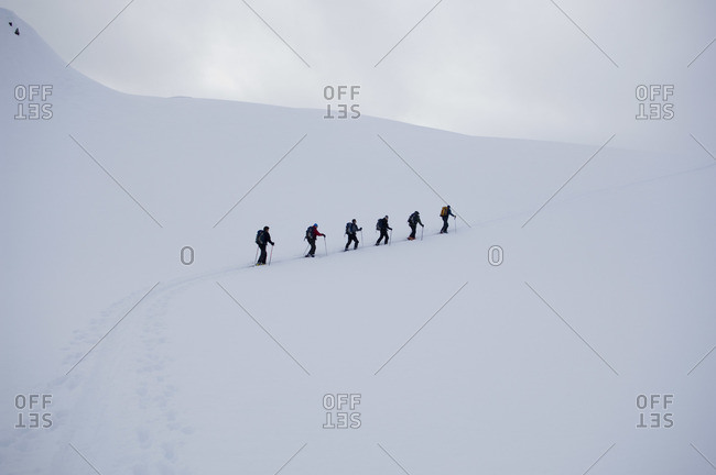 Skiers on Mountainside, Selkirk Mountains, British Columbia, Canada