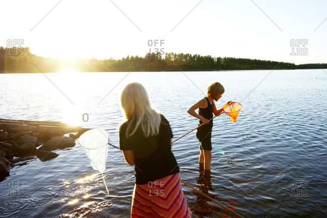 Girls fishing with landing net