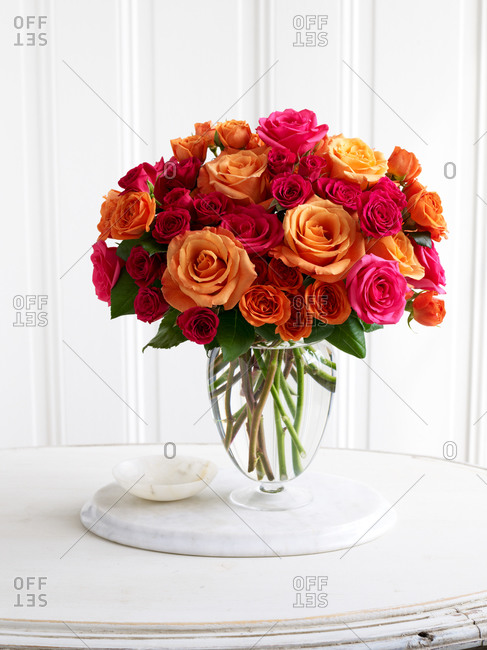 Colorful roses in glass vase
