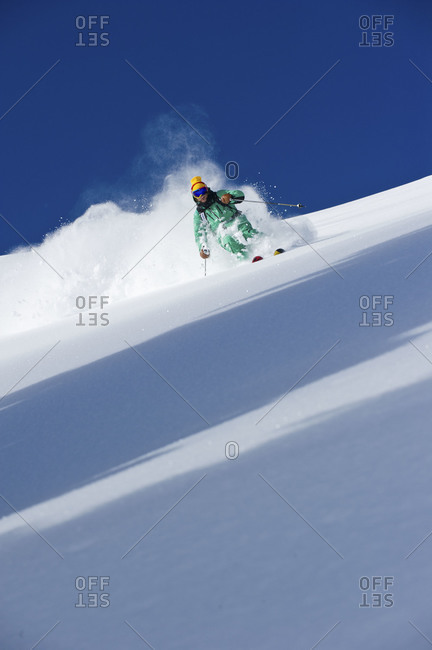 man skiing powder,  Utah