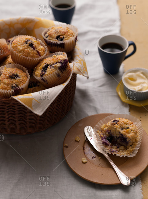Blueberry-corn muffins on brown plate