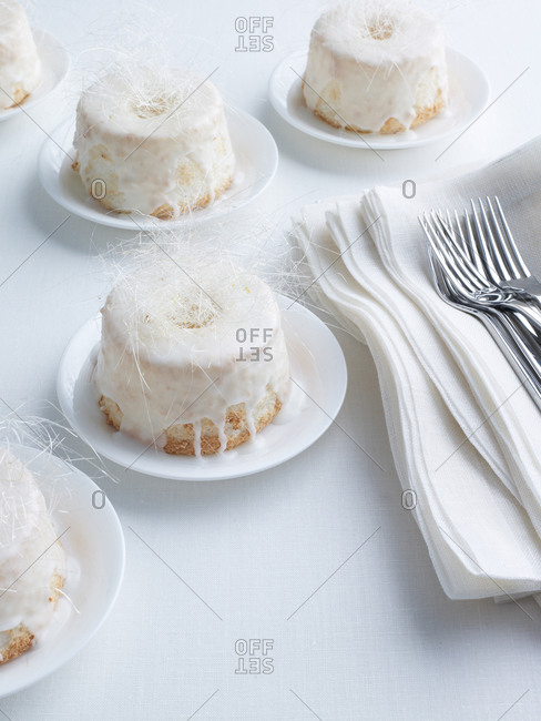 Mini angelfood cakes with icing and spun-sugar crown