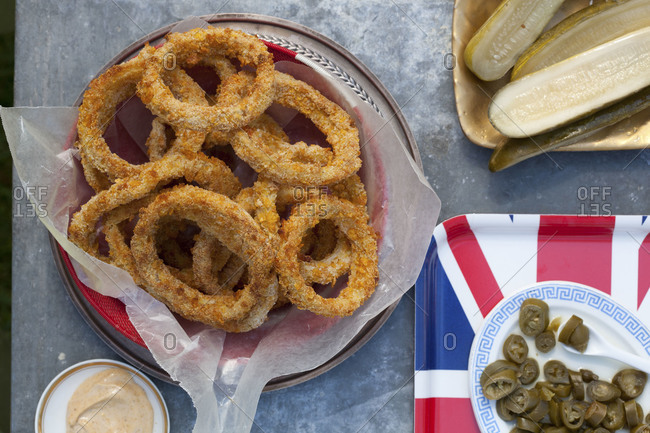 Bowl of onion rings served for party with other starters