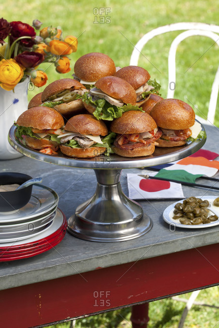 Different savory sliders on cake stand