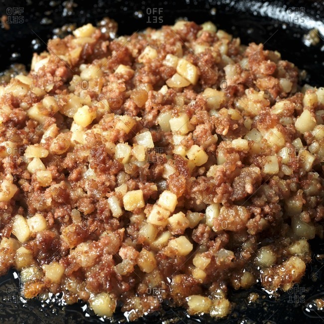 Canned Corned Beef Hash Frying in a Skillet