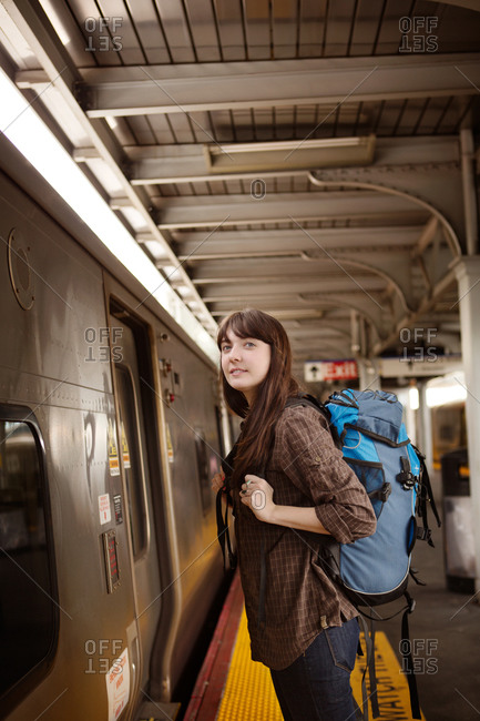 Young woman waiting for a train at the station