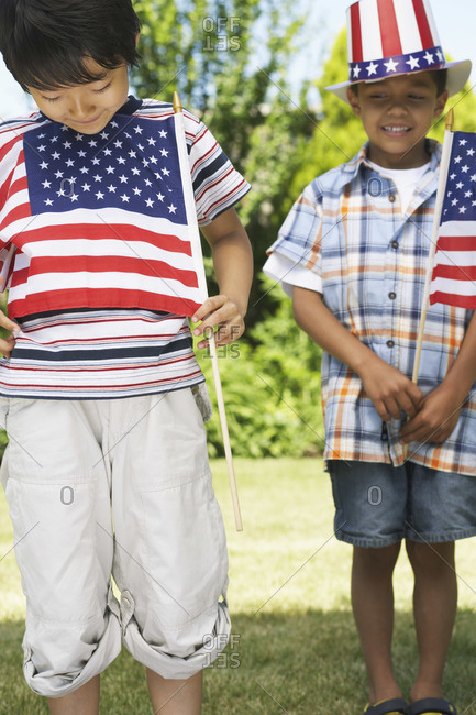 Boys holding American flags