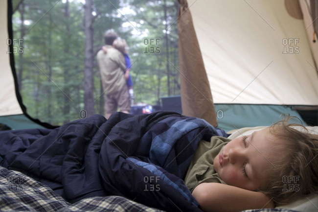 Four-year-old boy sleeps in a tent