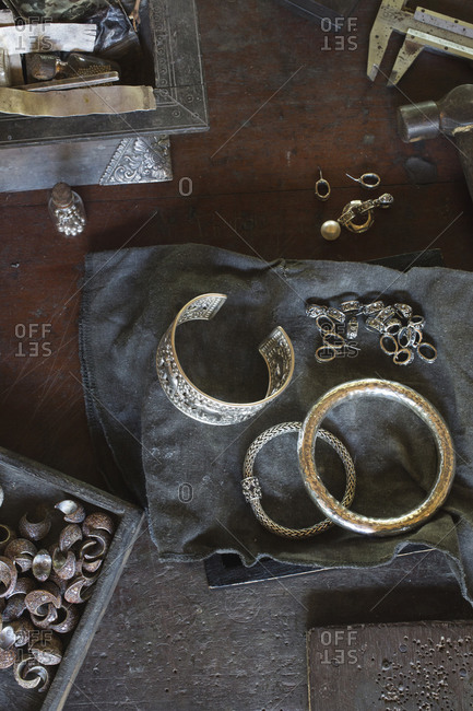 Overhead view of Thaibracelets and earrings on table