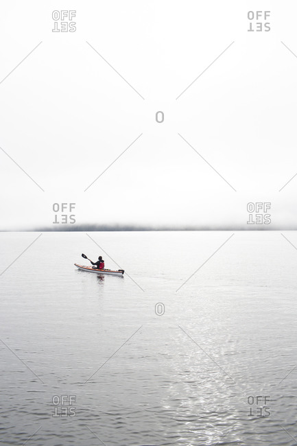 Woman kayaking on the calm water