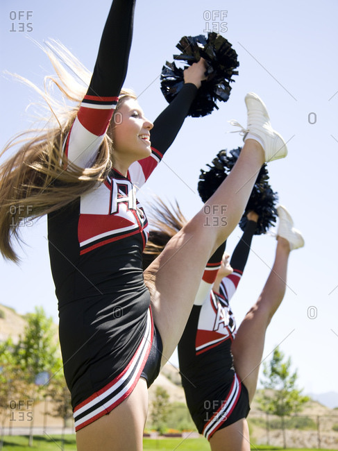 Cheerleaders doing high kick