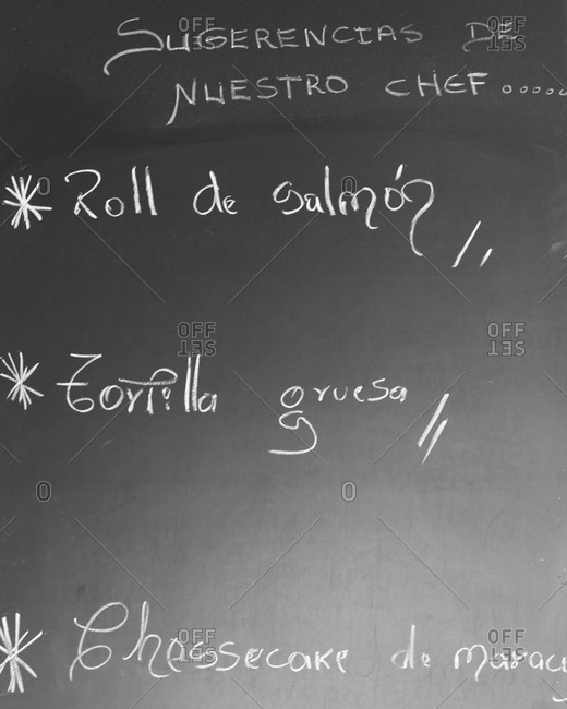 the specials of the day written on a chalkboard in a restaurant