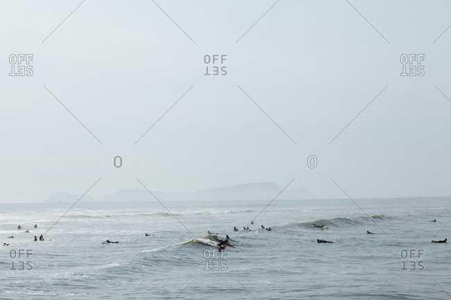 People riding the waves of the ocean