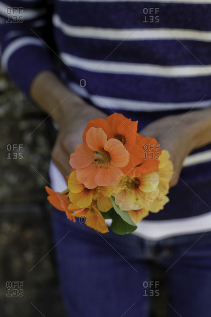 Close-up of a flower bouquet held by a woman