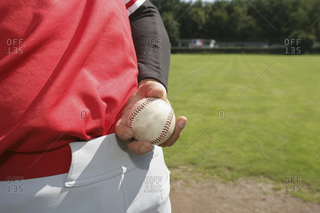 Close-up of a baseball pitcher holding a baseball