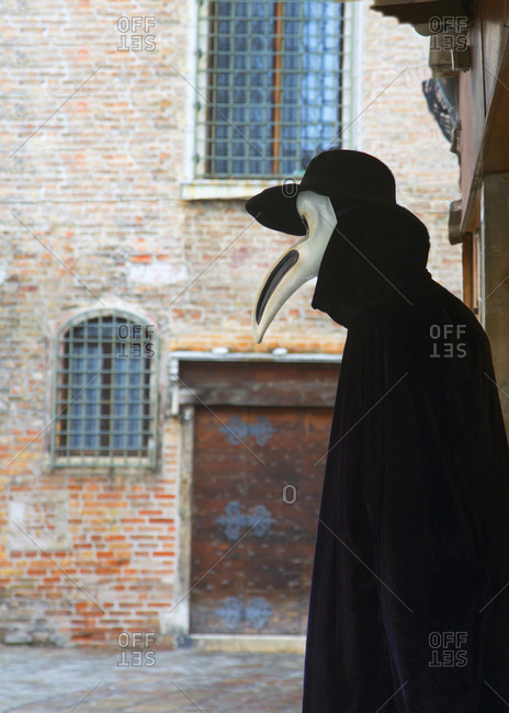 Bird-like beak masked person on the Venice Carnival