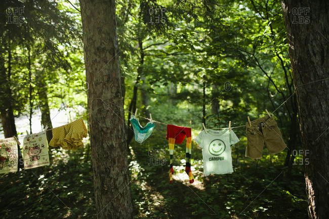 Children\'s clothes hanging on washing line