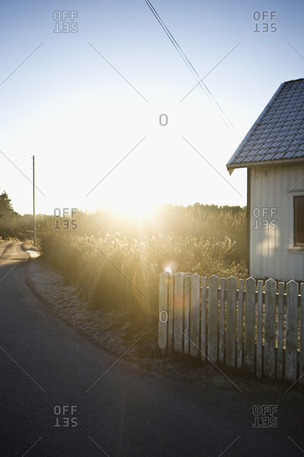 A house and a road against the light,  Sweden
