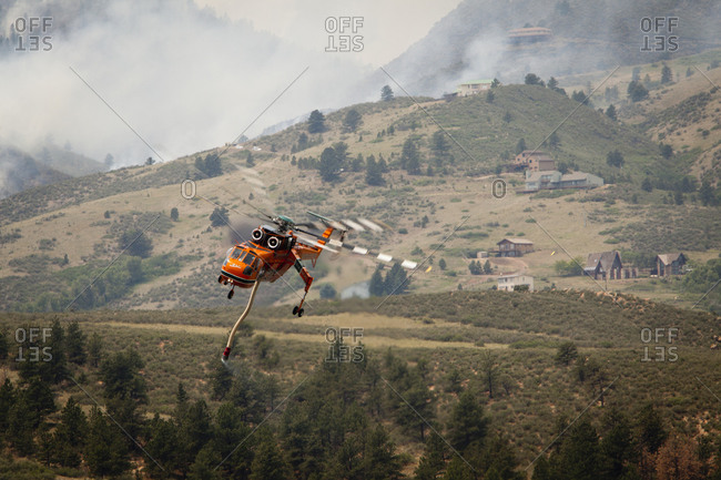 A view of a forest fire fighting helicopter