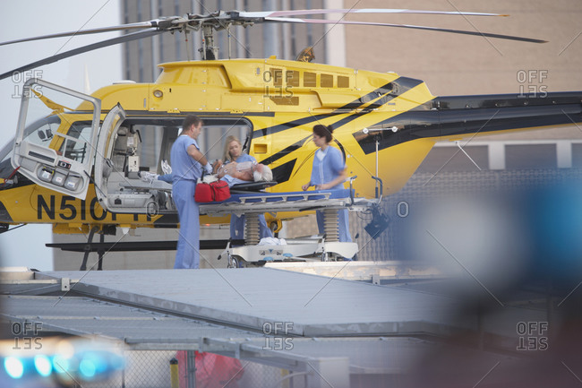 Doctors unloading patient from medical helicopter