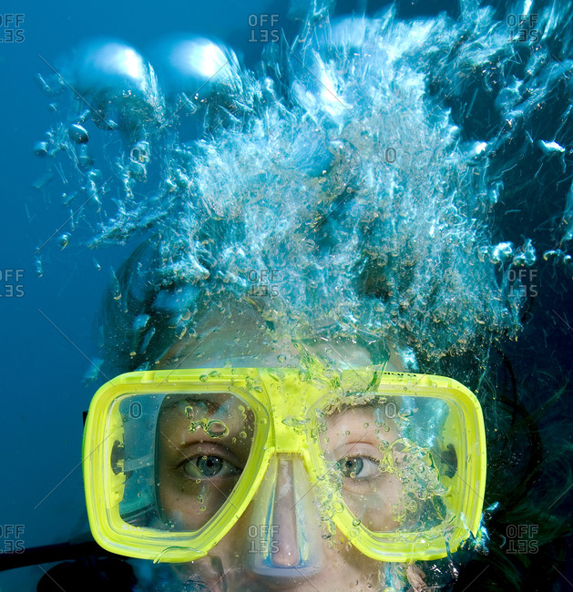 Close up of teenager\'s face while scuba diving
